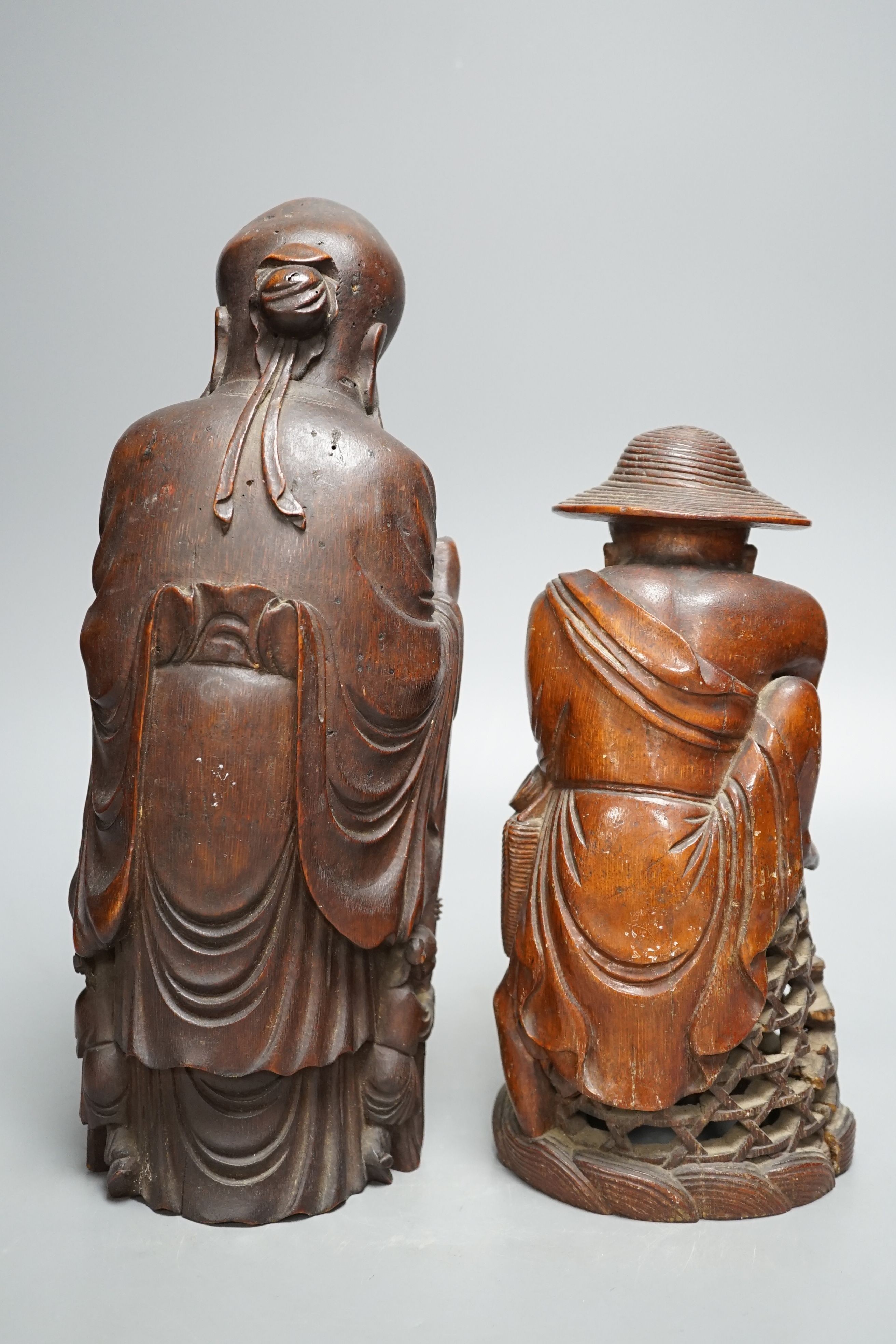 A 19th century Chinese bamboo figure of Shou Lao and a similar bamboo carving of a fisherman, 32 and 25cm, some losses